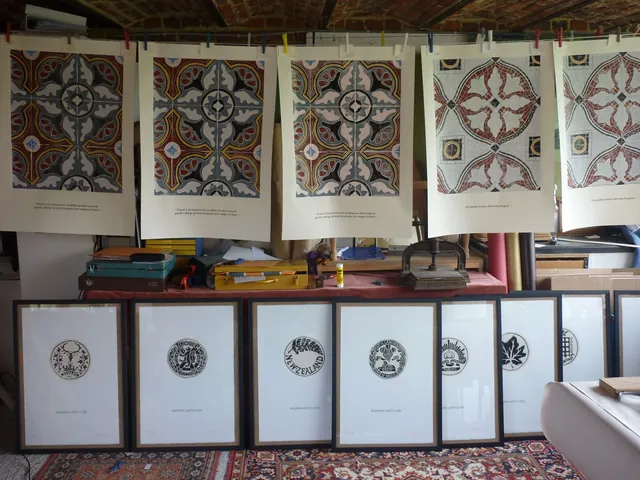 Prints hung to dry under the brick vault of the studio, above a row of framed linocuts